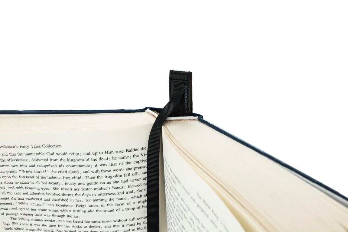 Bookmark holder, made from a disposed hardback novel with the pages folded  back into each other. The bookmarks …